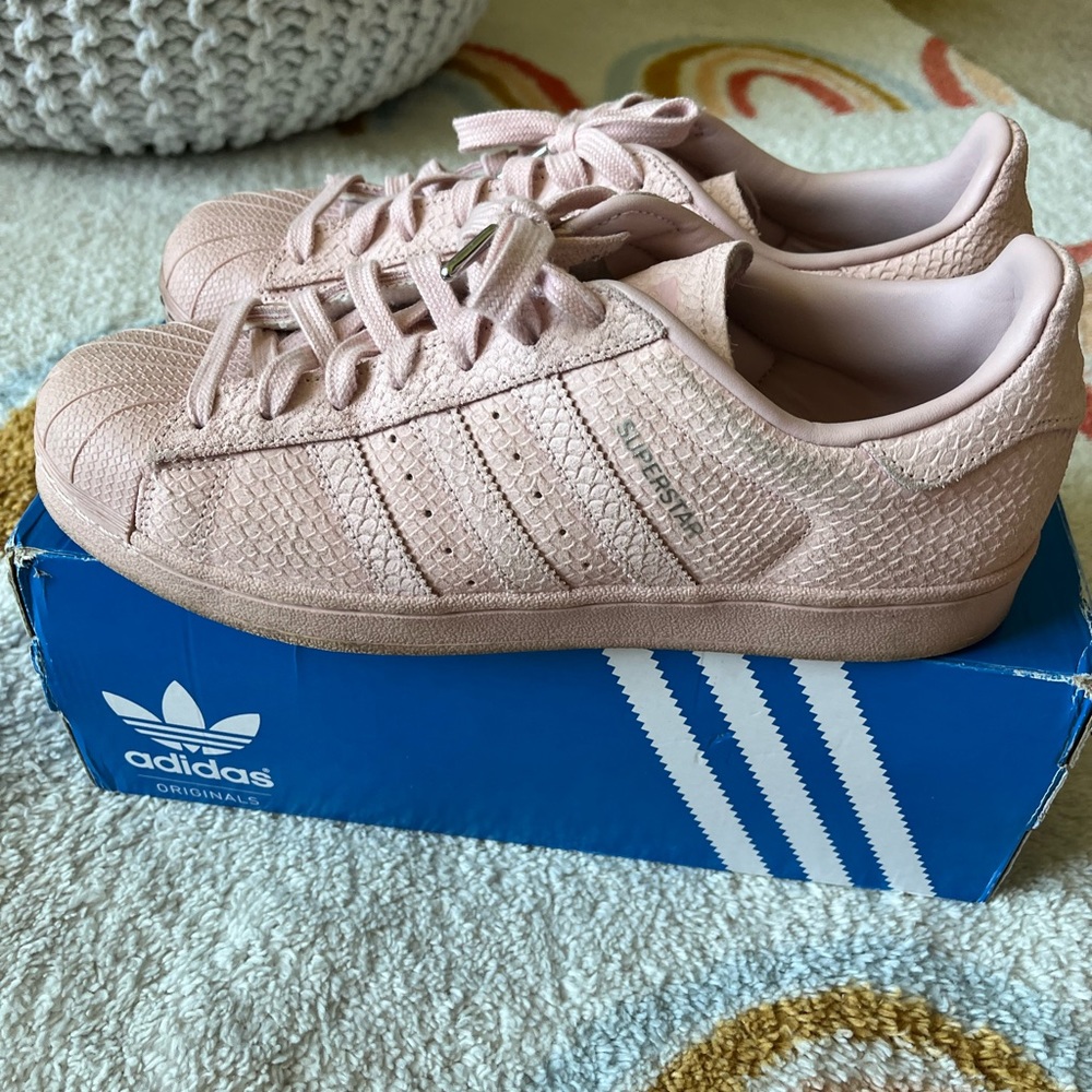 Pink Adidas Superstar shoes